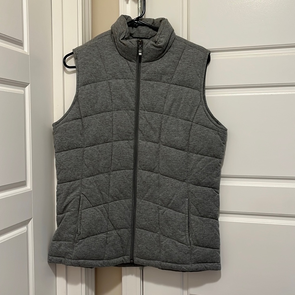 Gray full zip vest.